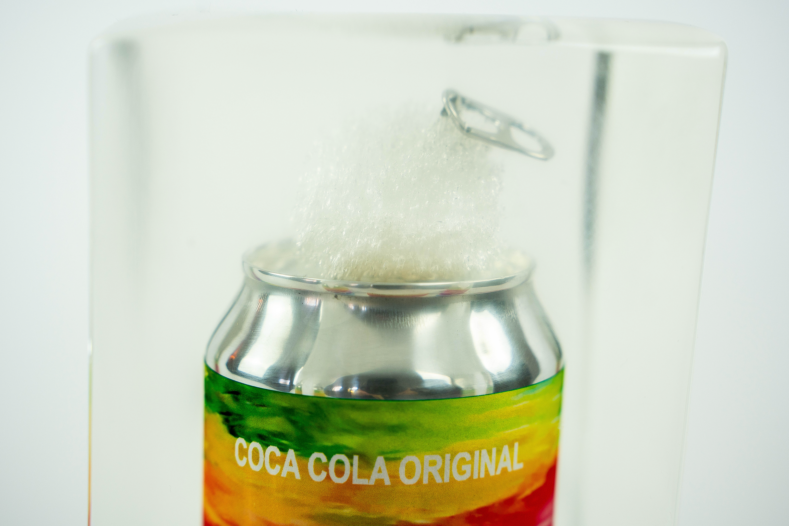 Rainbow coke trapped in a glass