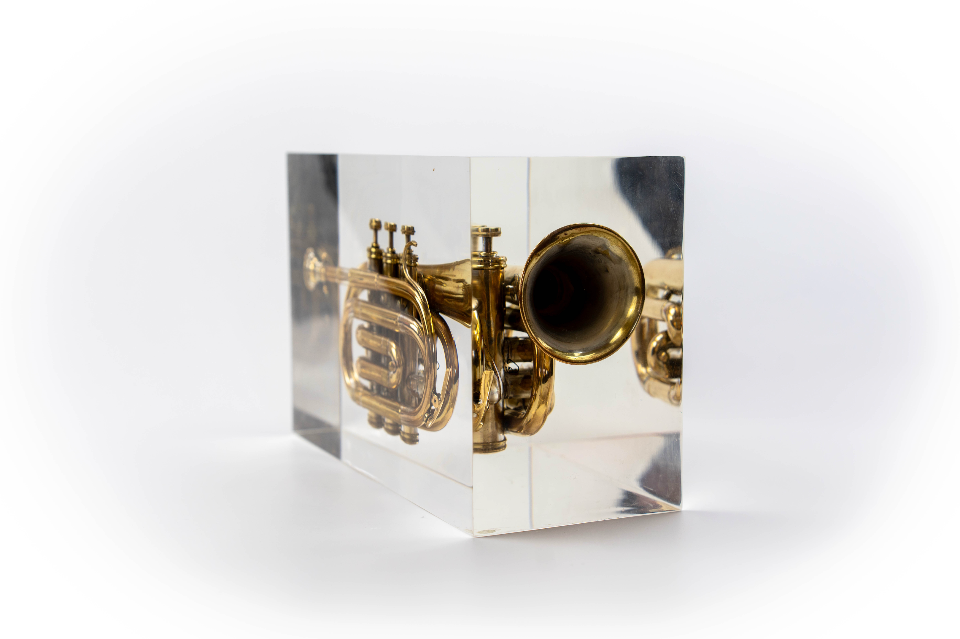Trumpet trapped in glass