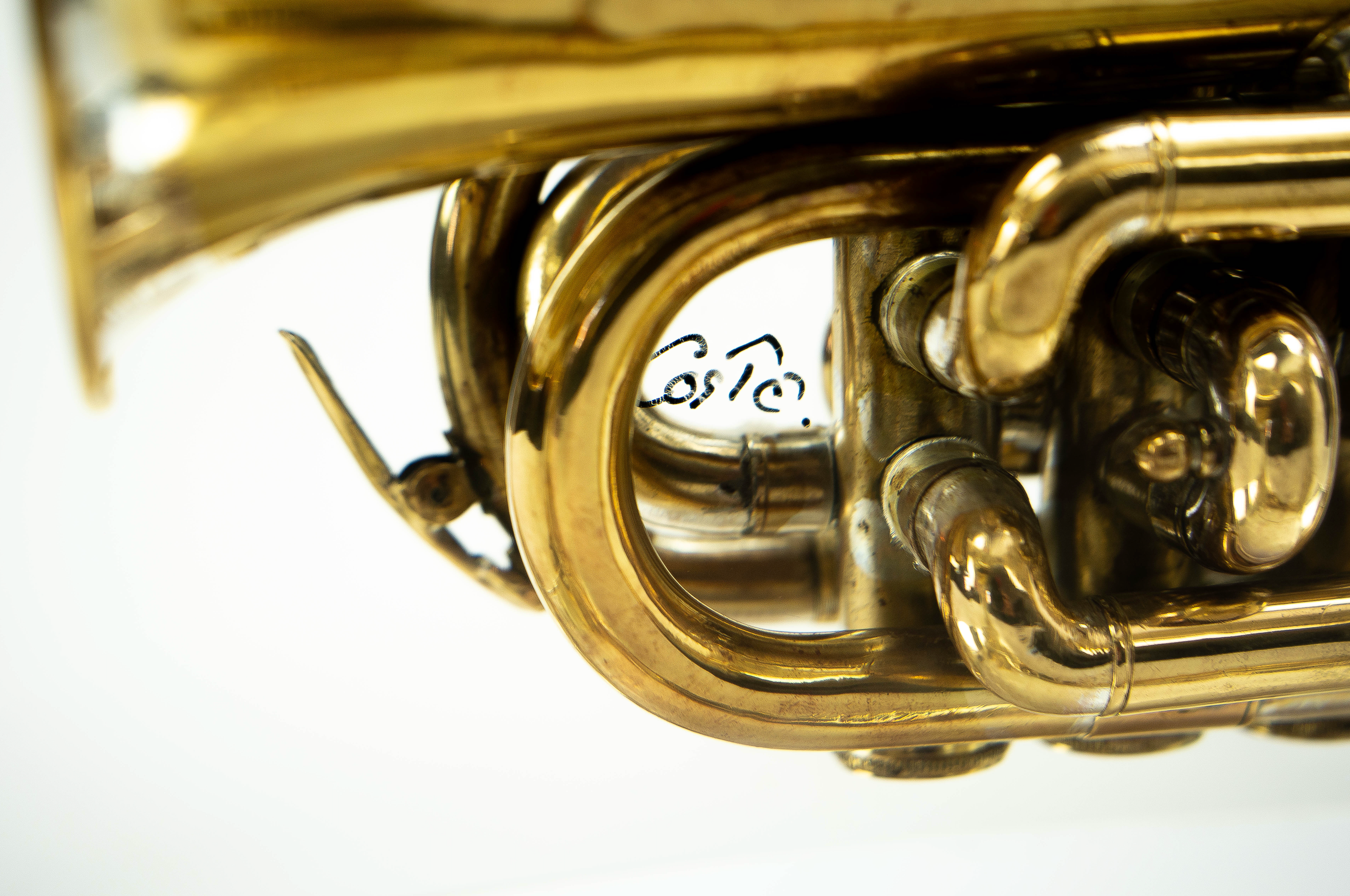 Trumpet trapped in glass